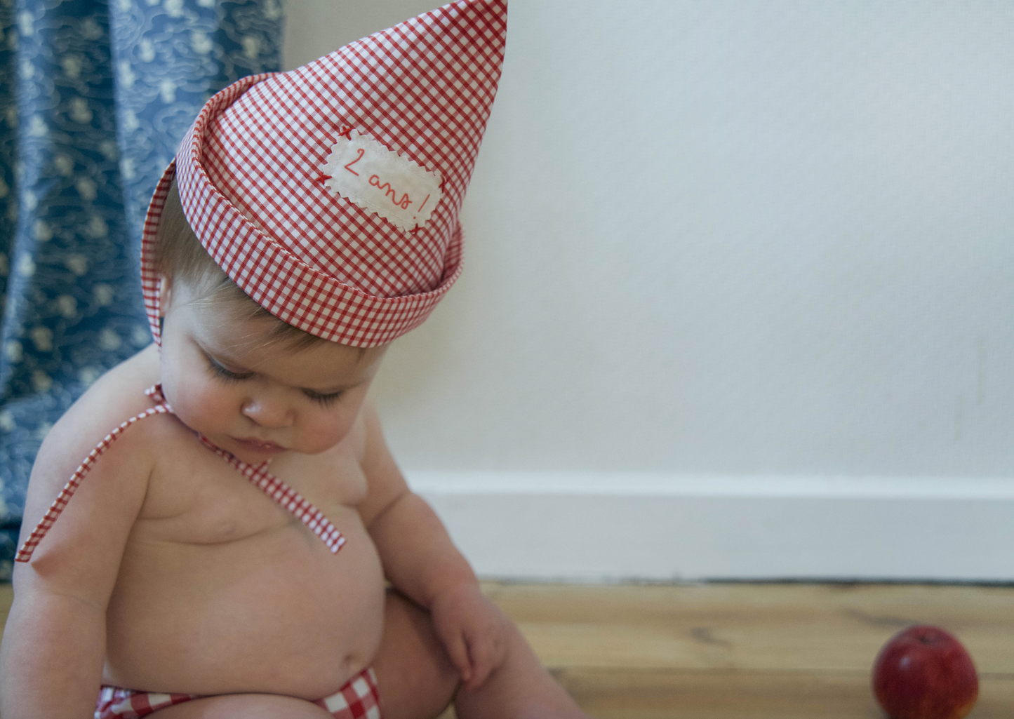 Pointed red checkered birthday hat